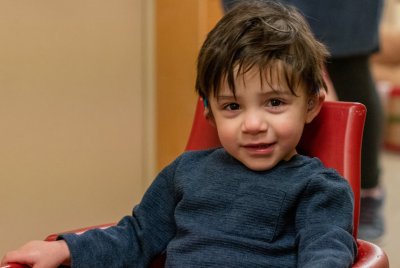 Jackson smiles as he sits in wagon at PEI.  